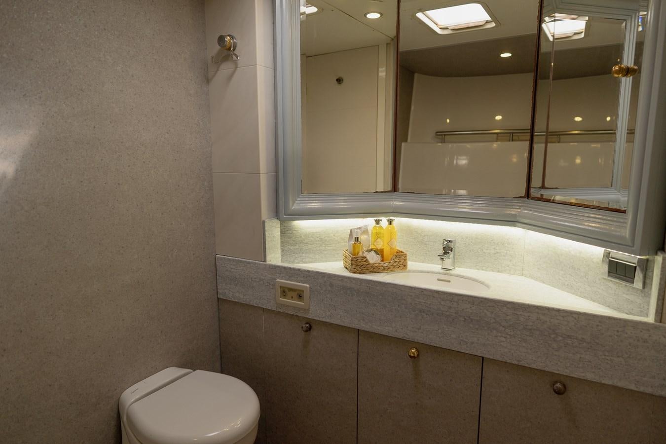 a bathroom with a large mirror aboard YQUEM Yacht for Sale