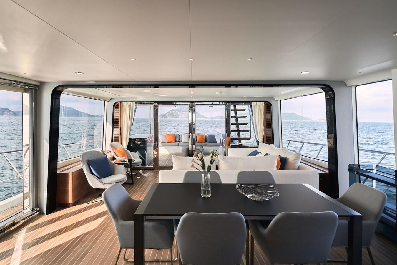 a dining room with a large window aboard CLX96/01 Yacht for Sale