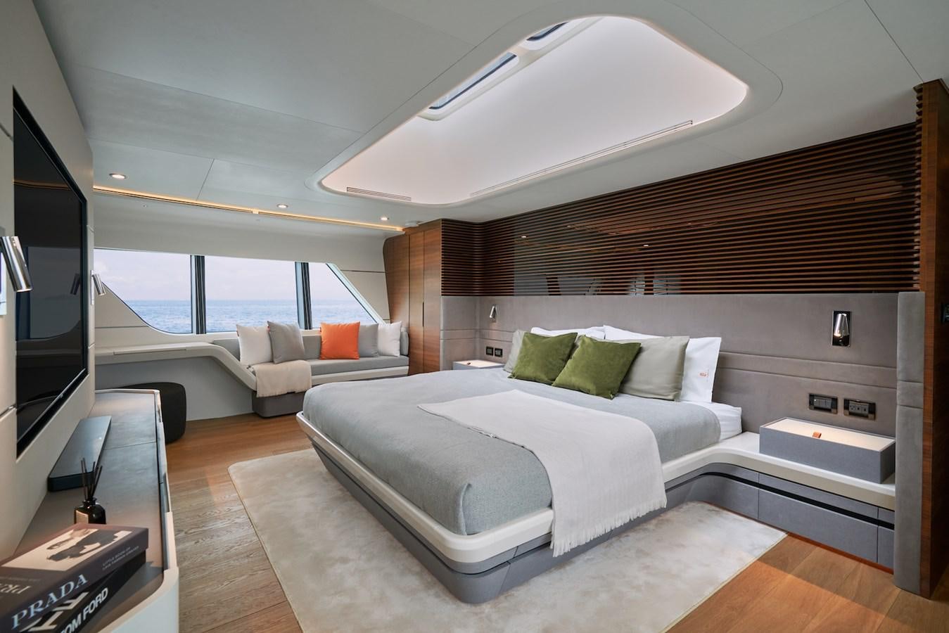 a room with a bed and a couch aboard CLX96/01 Yacht for Sale
