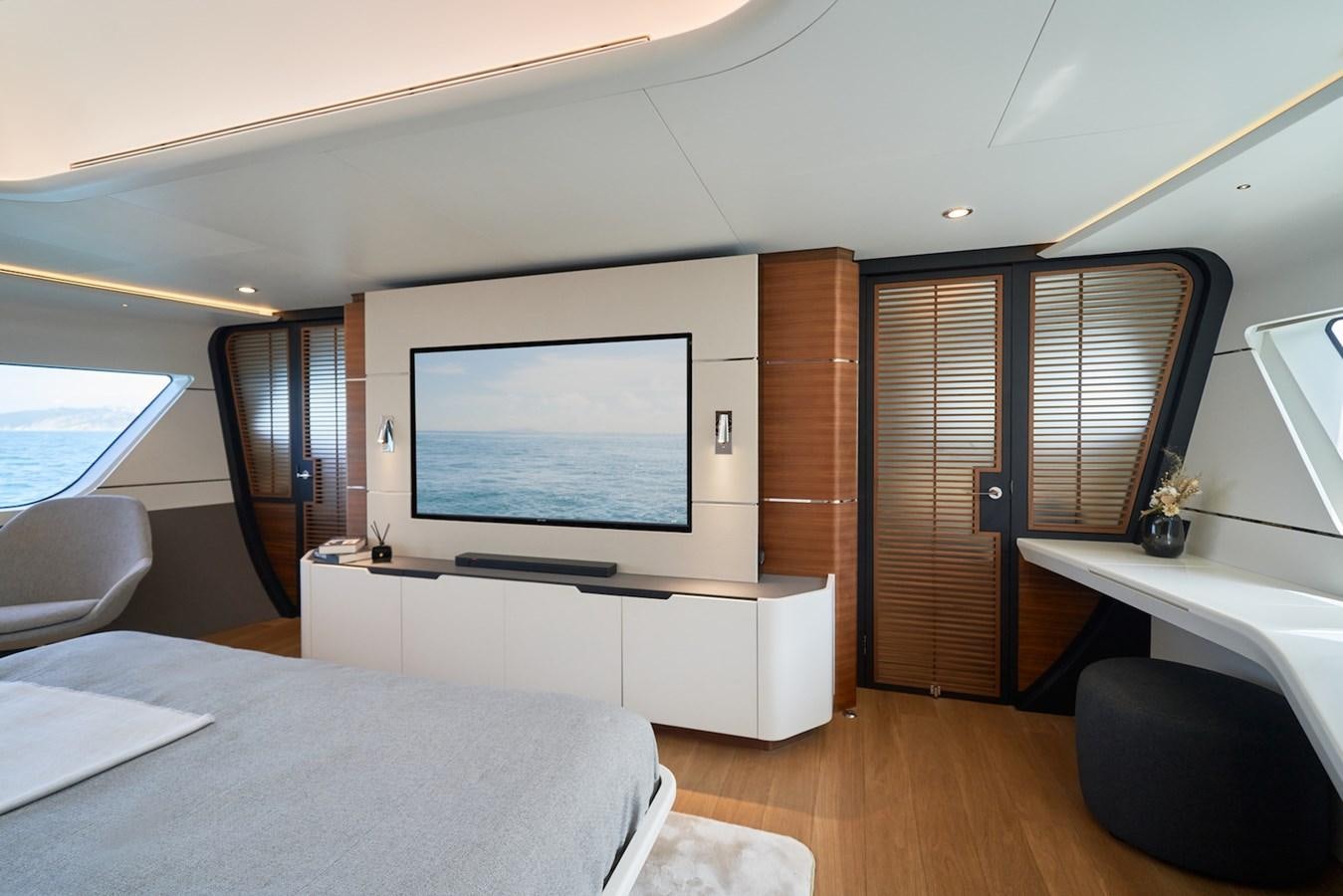 a room with a tv and a table aboard CLX96/01 Yacht for Sale