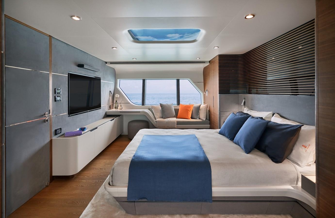 a bedroom with a bed and a tv aboard CLX96/01 Yacht for Sale