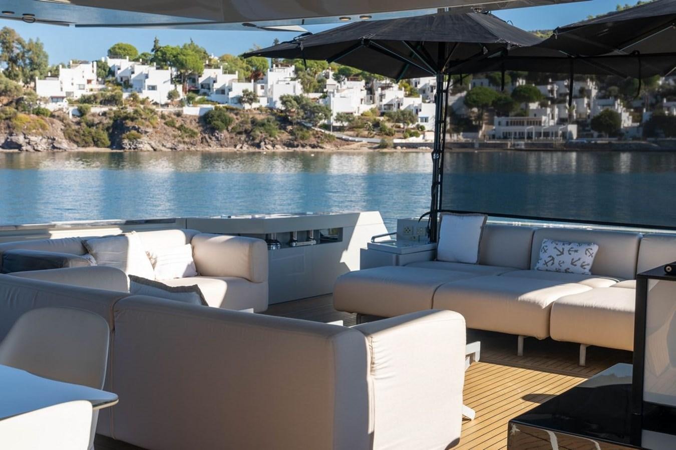 a boat with a couch and a table on it aboard ANGELS Yacht for Sale