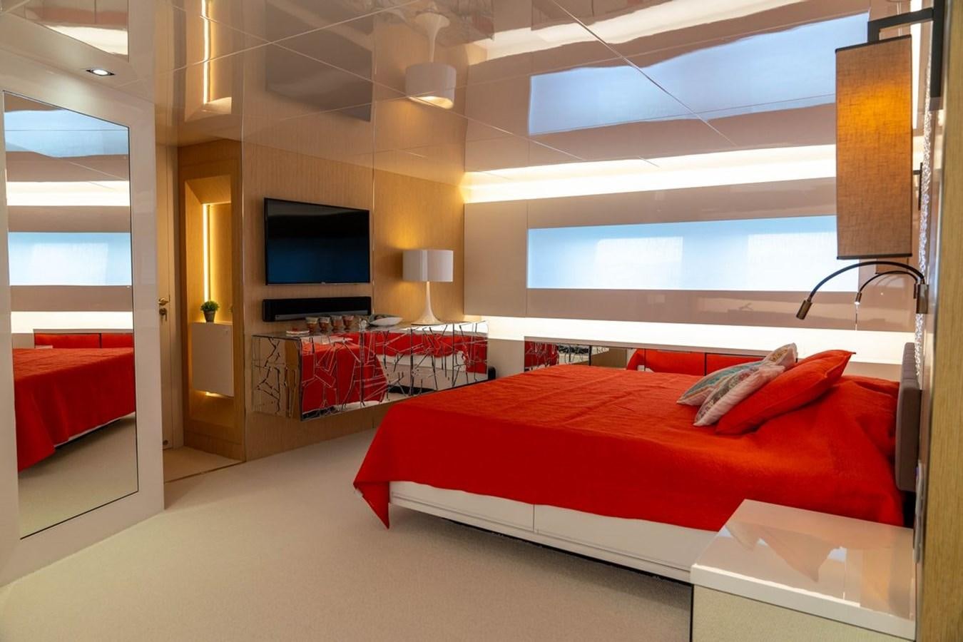 a room with a bed and a tv aboard ANGELS Yacht for Sale
