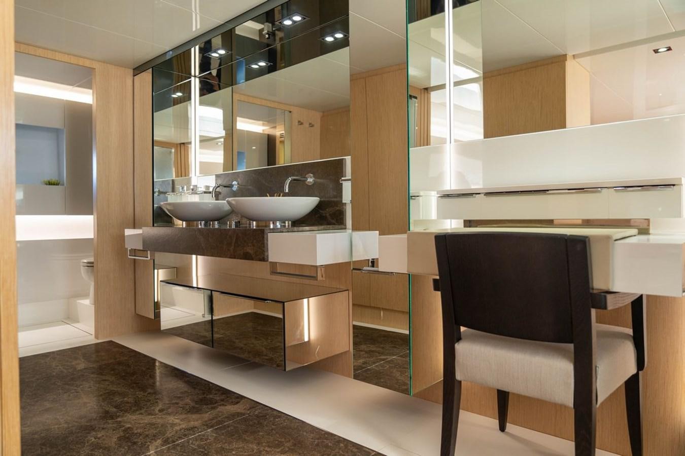 a kitchen with a sink and a chair aboard ANGELS Yacht for Sale