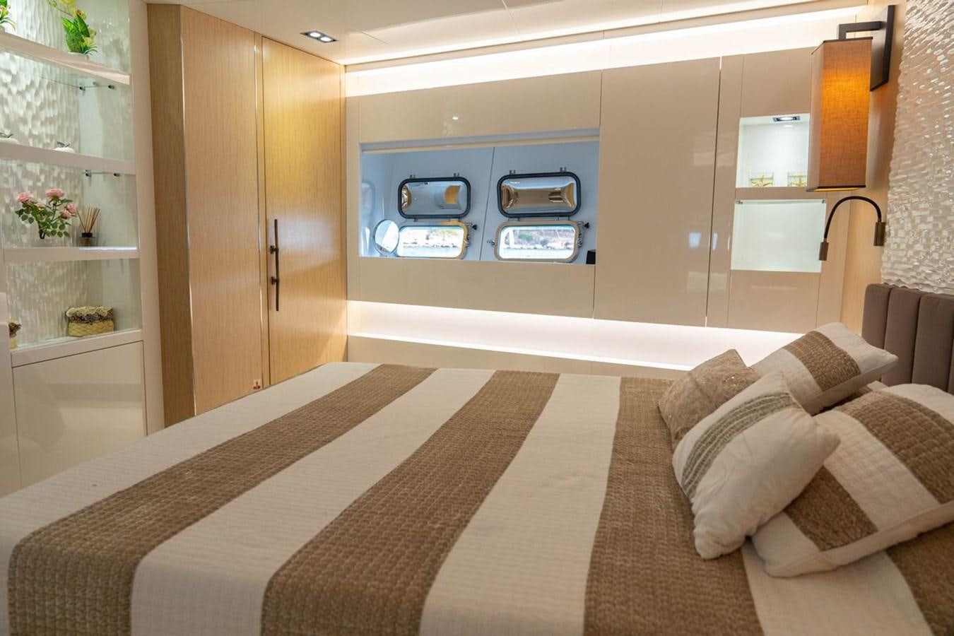 a room with a bed and a tv aboard ANGELS Yacht for Sale