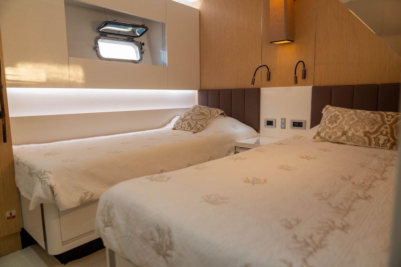 a couple of beds in a room aboard ANGELS Yacht for Sale