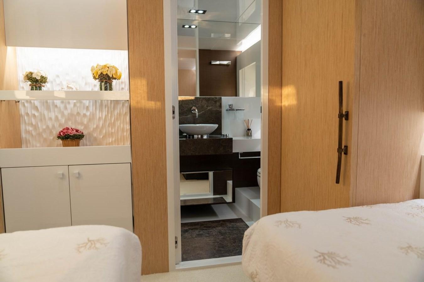 a bathroom with a sink and a bed aboard ANGELS Yacht for Sale