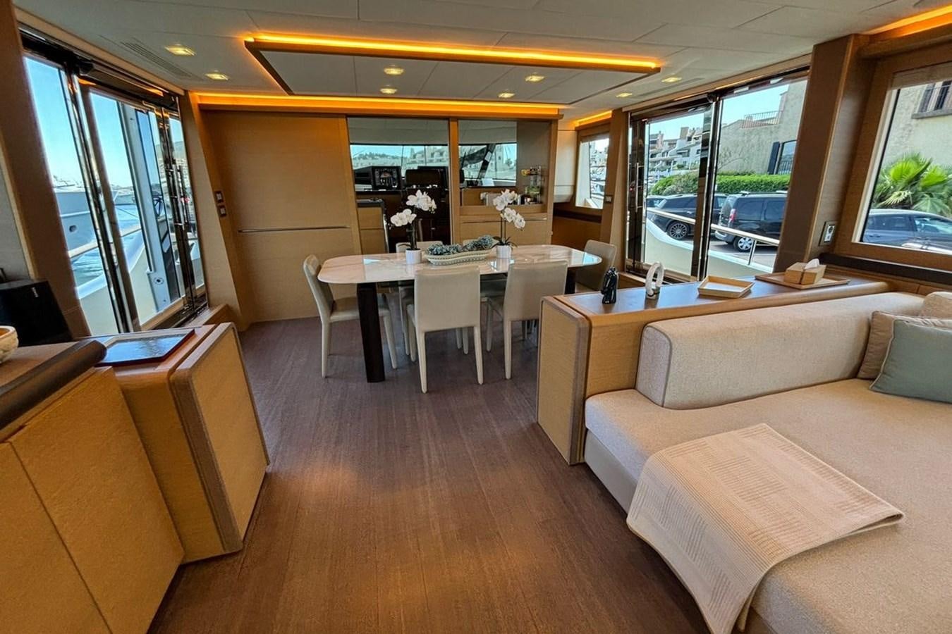 a room with a table and couches aboard NAYLA Yacht for Sale
