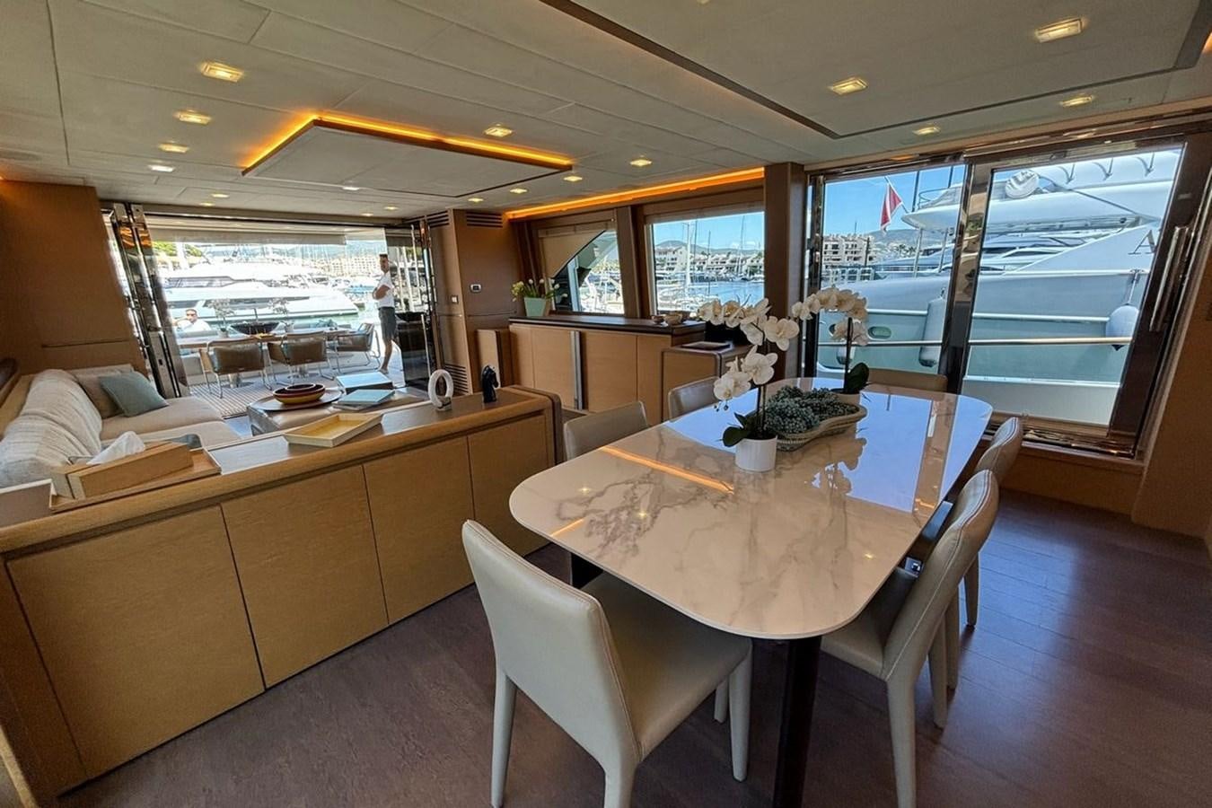 a large dining table in a restaurant aboard NAYLA Yacht for Sale