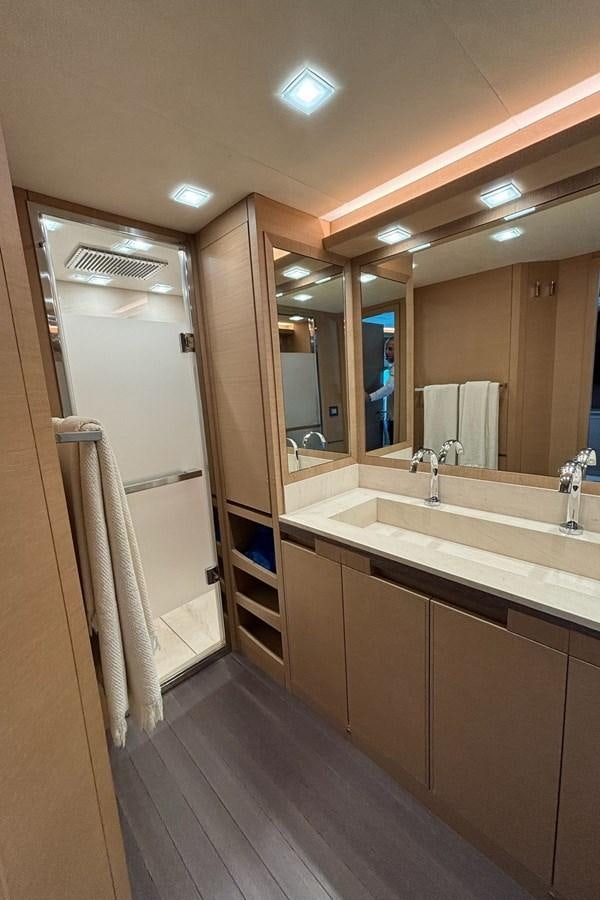 a bathroom with a large mirror aboard NAYLA Yacht for Sale