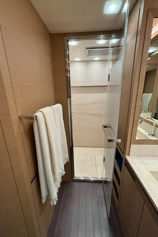 a bathroom with a shower unit and sink aboard NAYLA Yacht for Sale