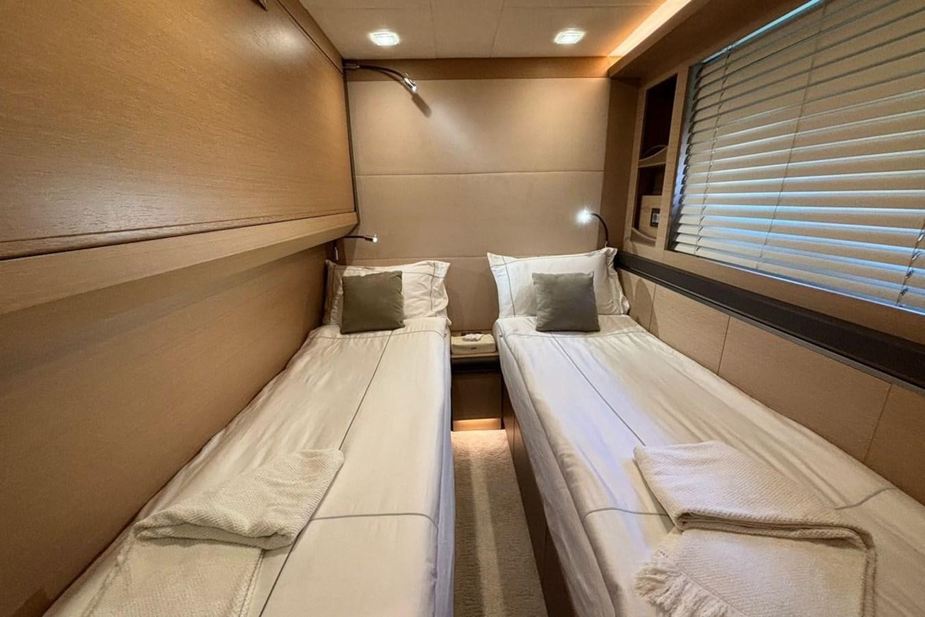 a room with two beds aboard NAYLA Yacht for Sale