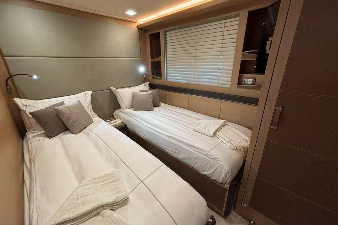 a room with two beds aboard NAYLA Yacht for Sale