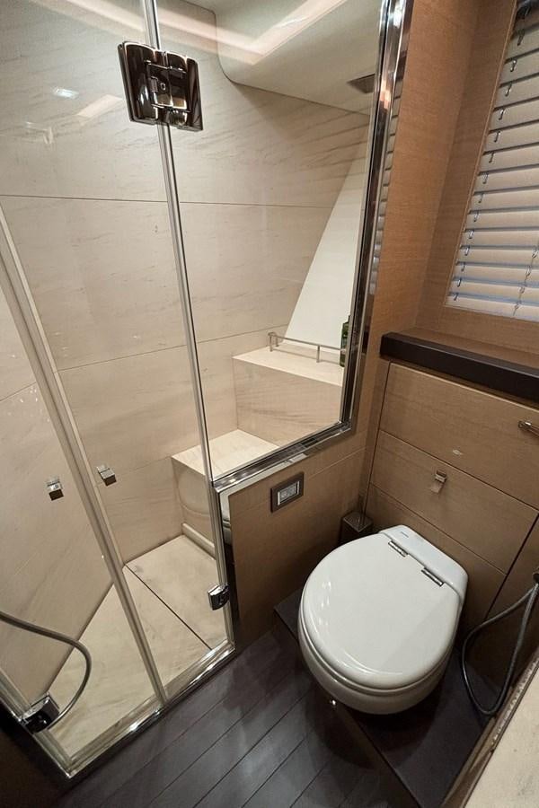 a bathroom with a glass shower aboard NAYLA Yacht for Sale