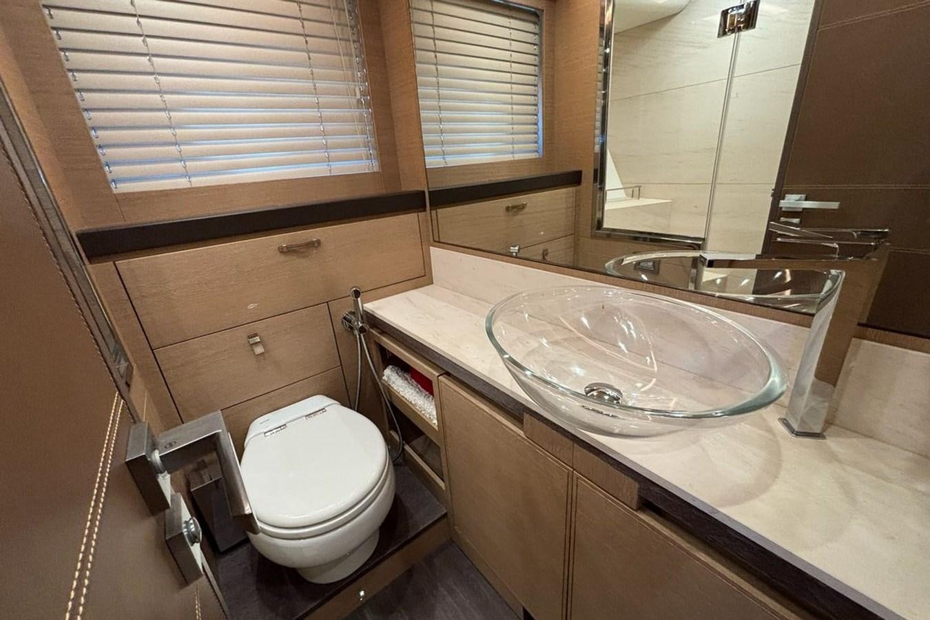 a bathroom with a sink and a toilet aboard NAYLA Yacht for Sale