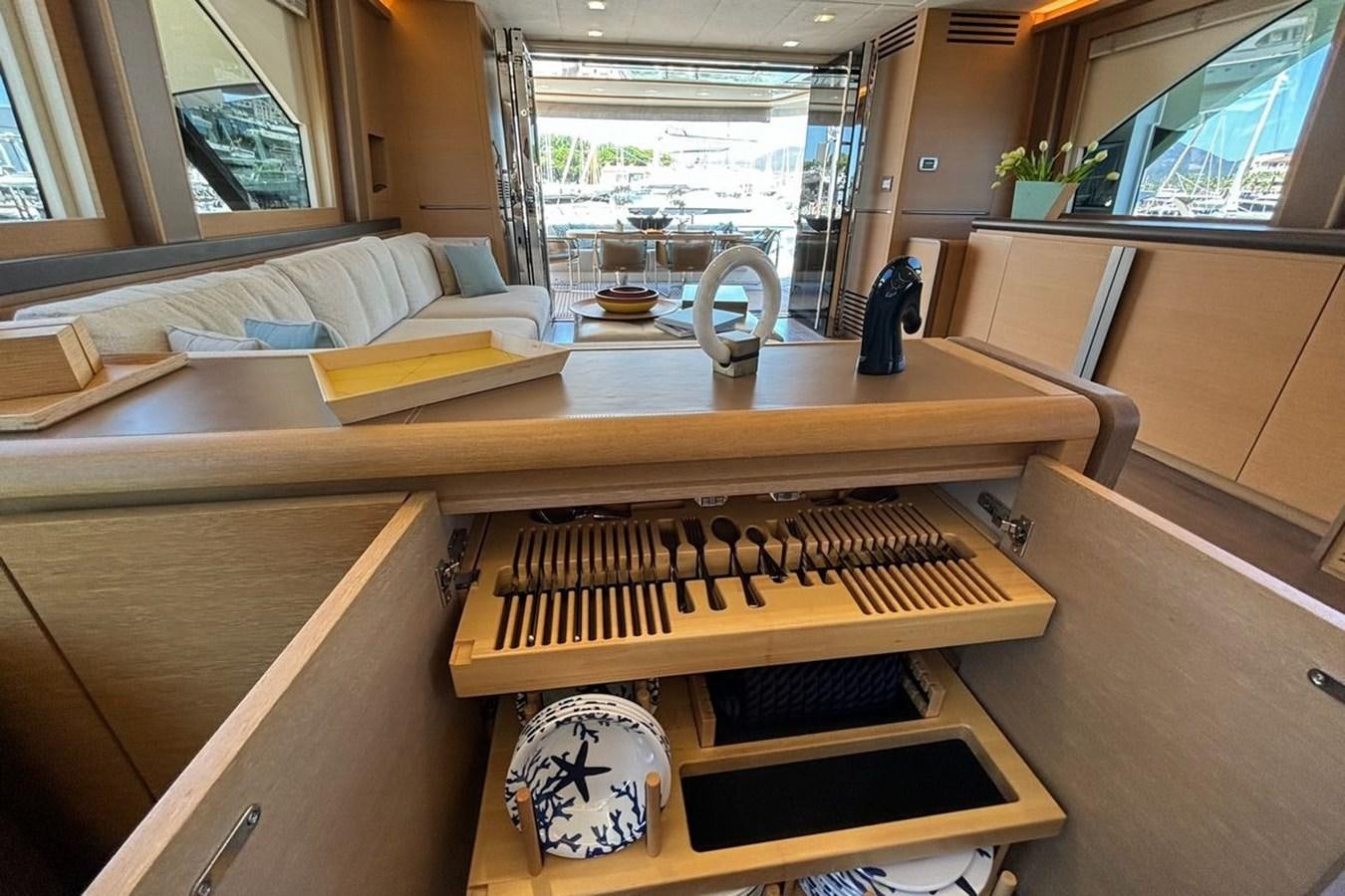 a desk with a fan and a pillow on it aboard NAYLA Yacht for Sale
