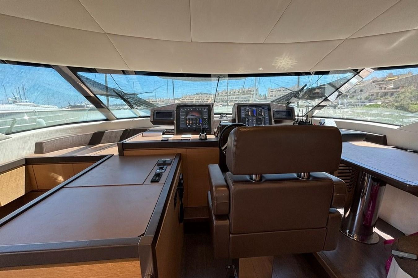 a room with a desk and chairs aboard NAYLA Yacht for Sale
