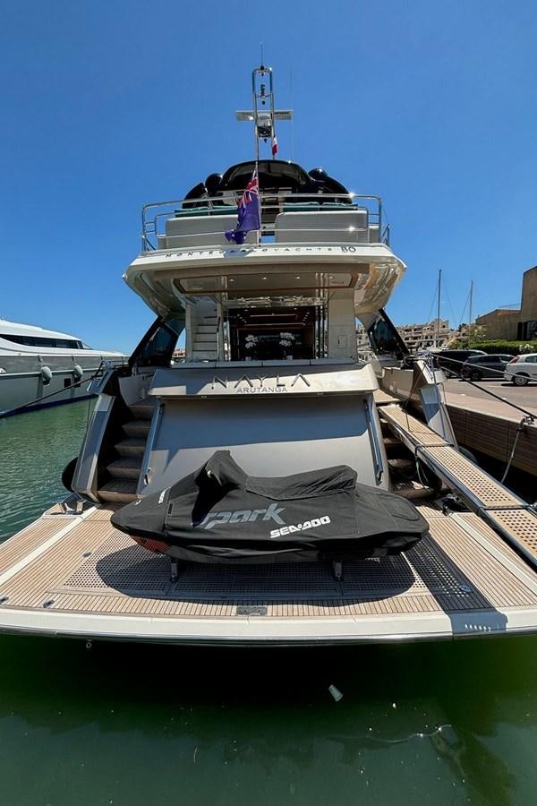 a boat docked at a pier aboard NAYLA Yacht for Sale