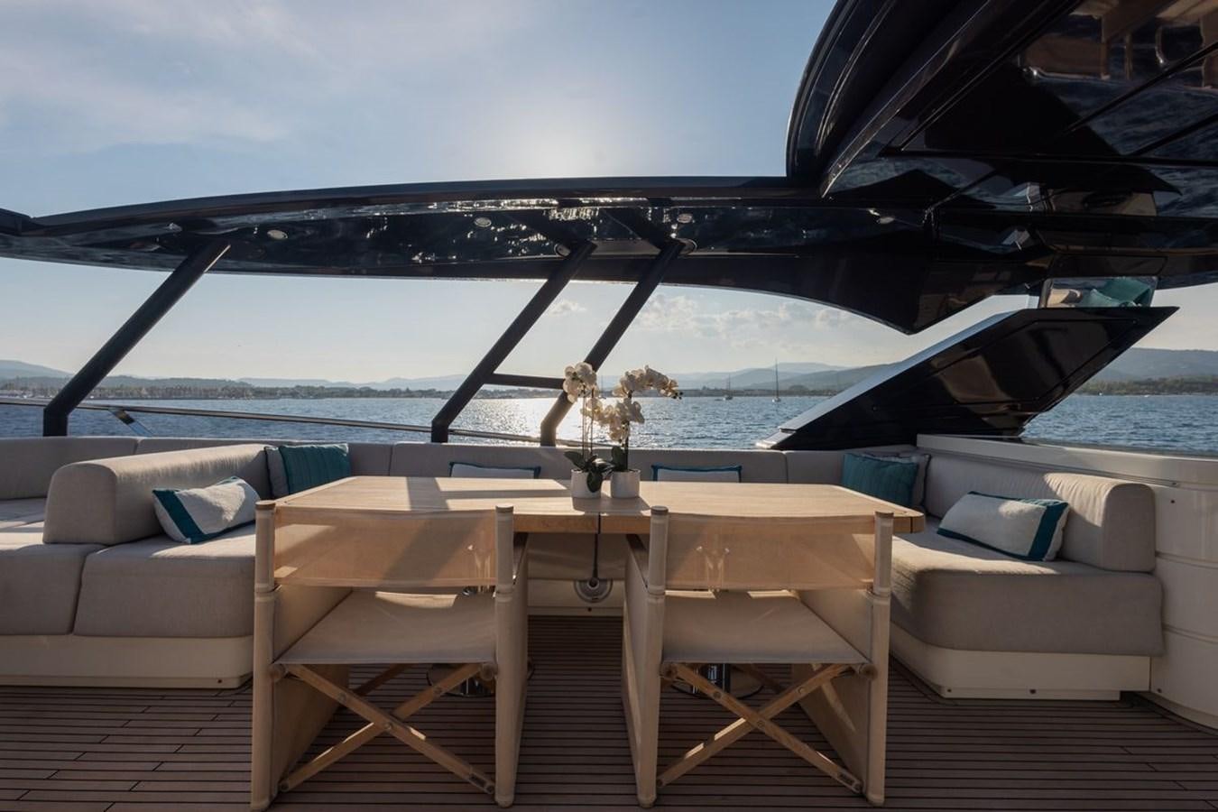 a table and chairs on a boat aboard NAYLA Yacht for Sale