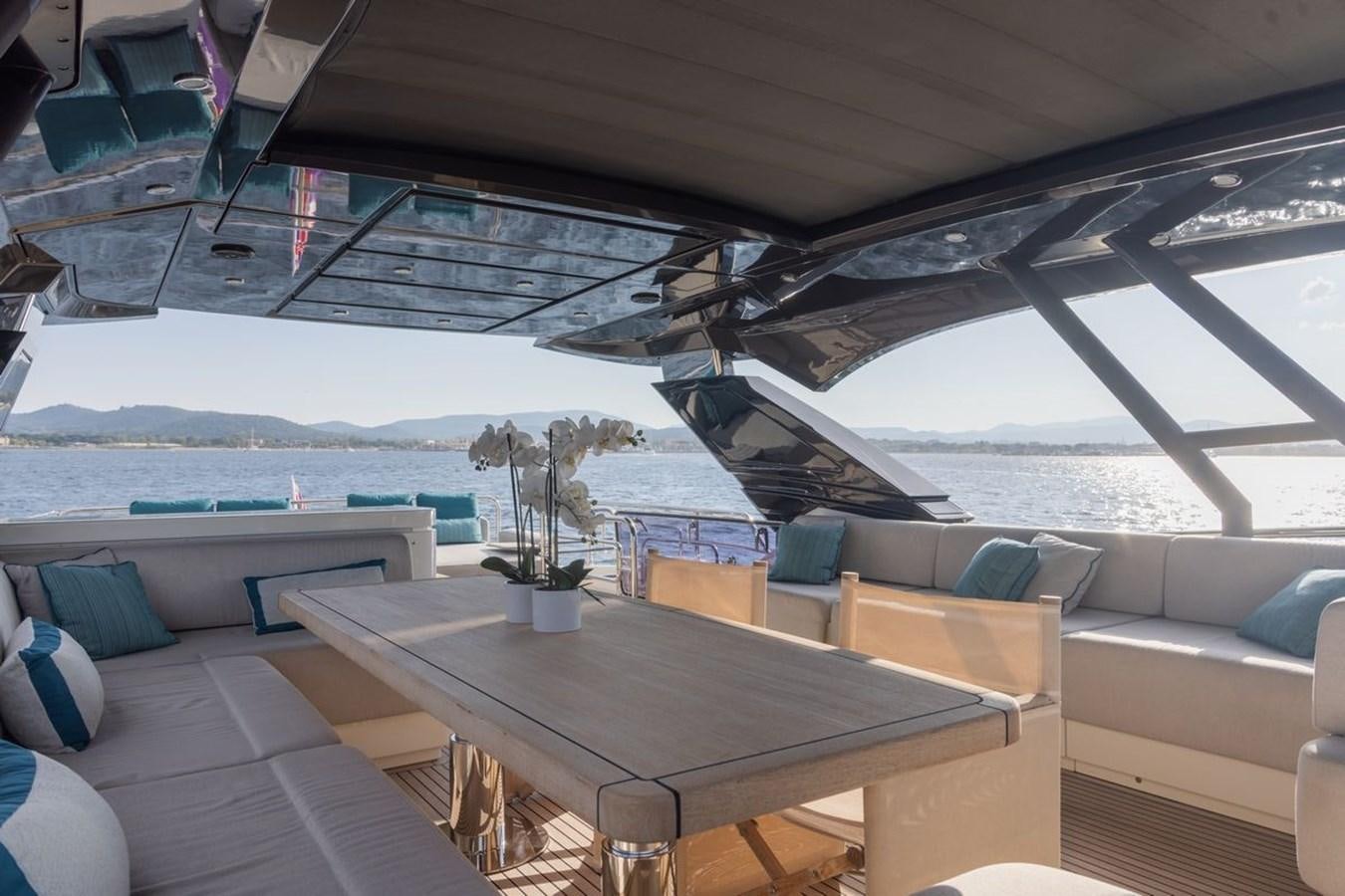 a room with a table and chairs aboard NAYLA Yacht for Sale