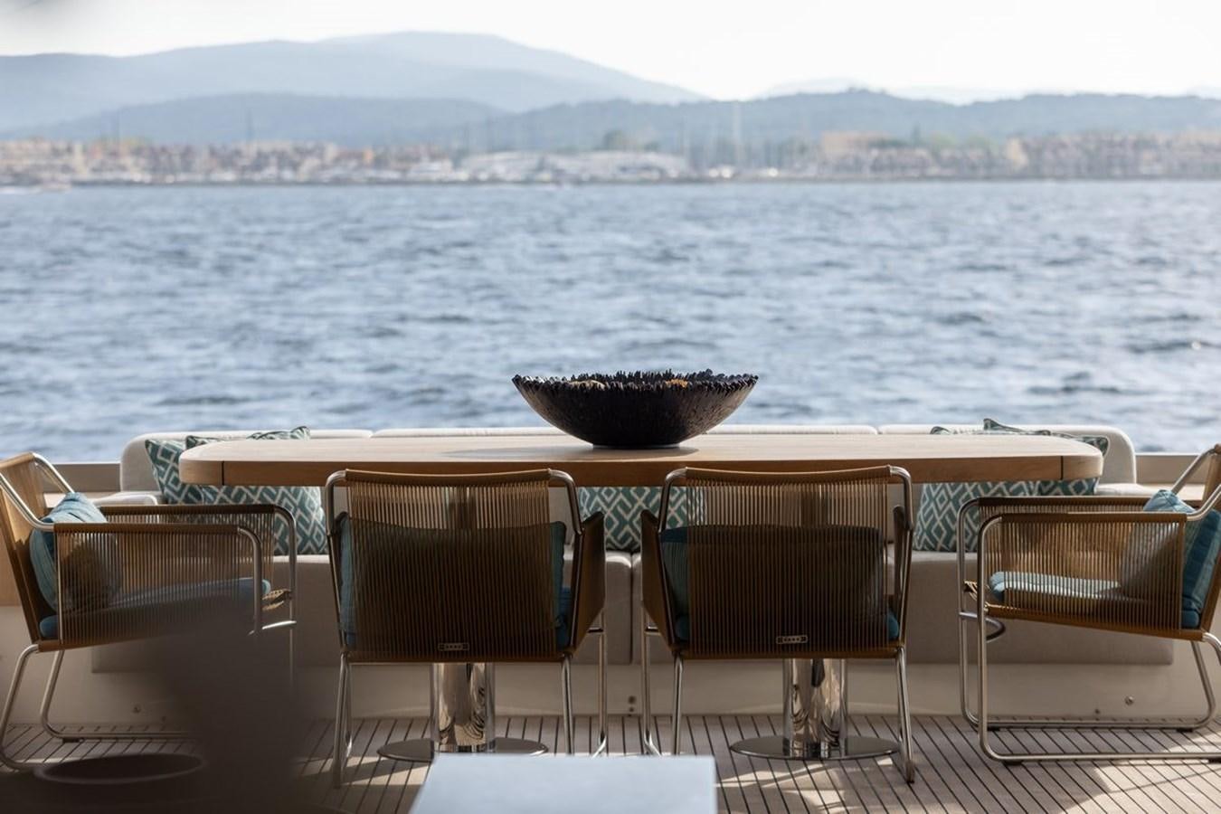 a table and chairs on a boat aboard NAYLA Yacht for Sale