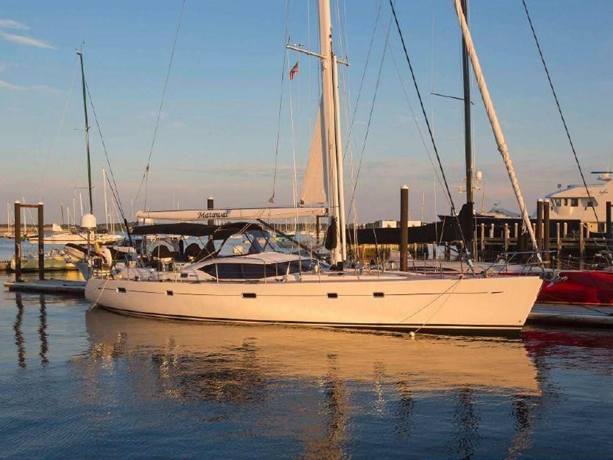 a boat is parked in a harbor aboard MATAWAI Yacht for Sale