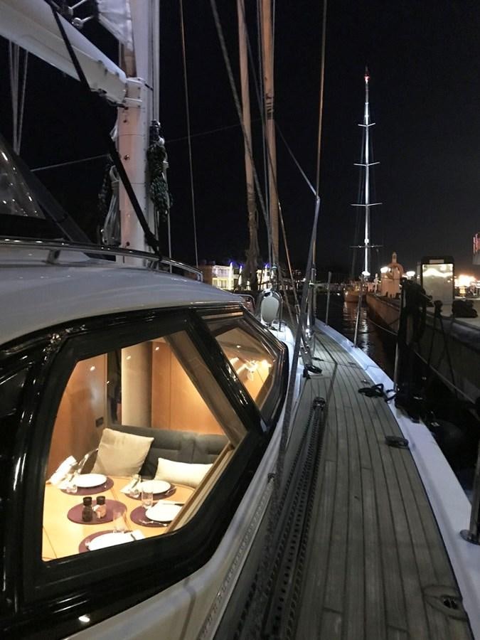 a boat with a table and chairs on it aboard MATAWAI Yacht for Sale