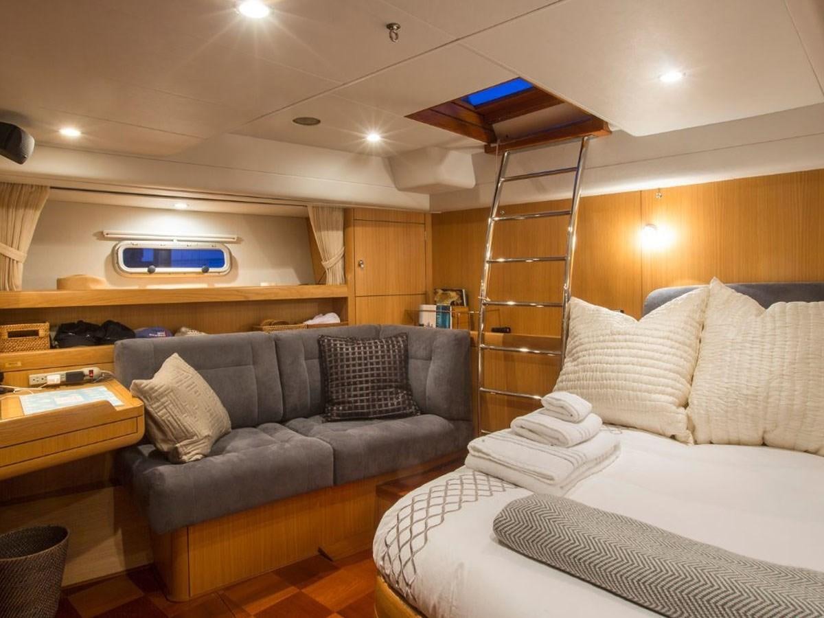 a living room with a couch and a ladder aboard MATAWAI Yacht for Sale