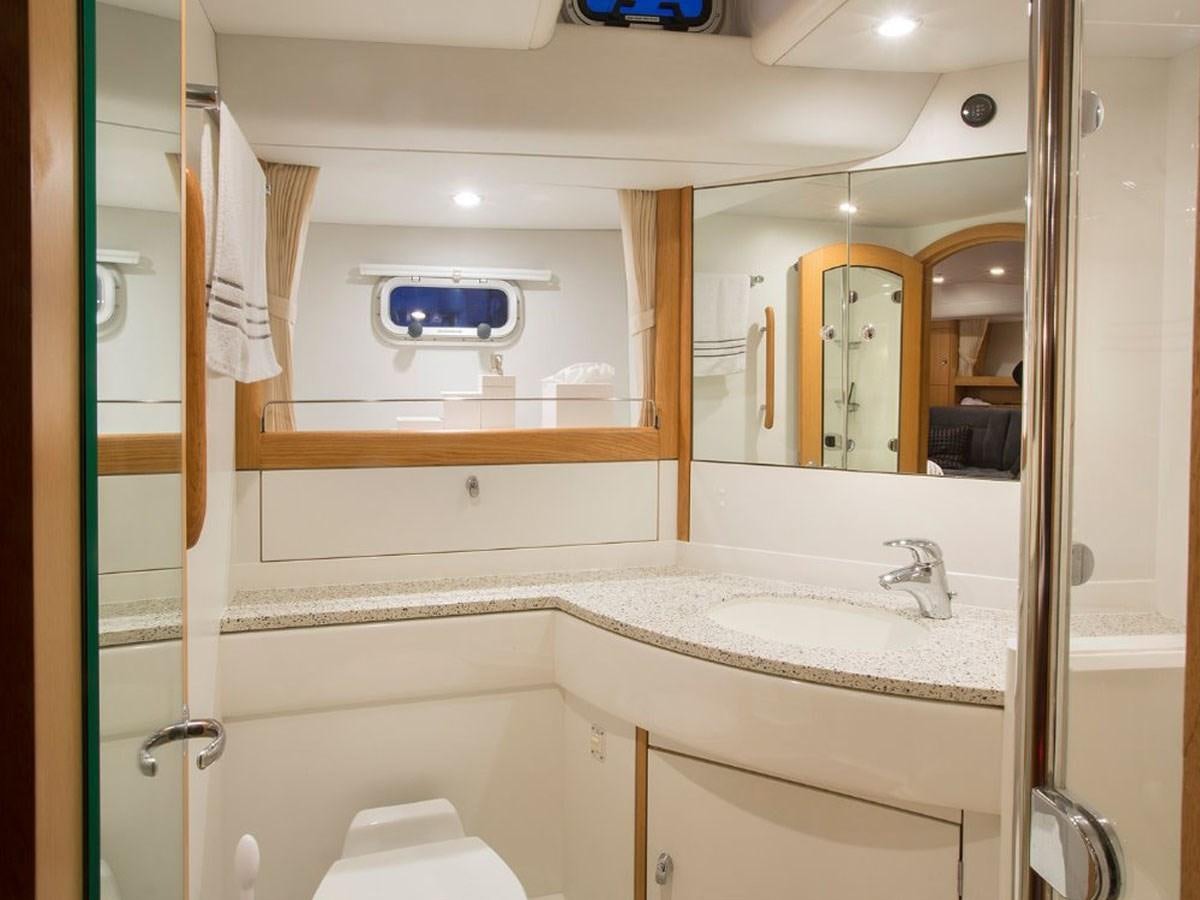 a bathroom with a large mirror aboard MATAWAI Yacht for Sale