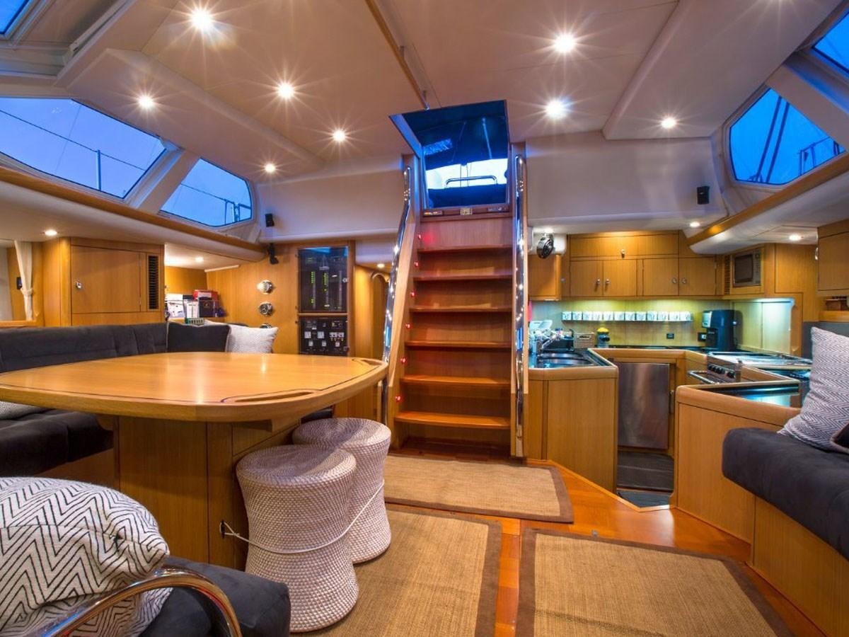 a kitchen with a staircase aboard MATAWAI Yacht for Sale