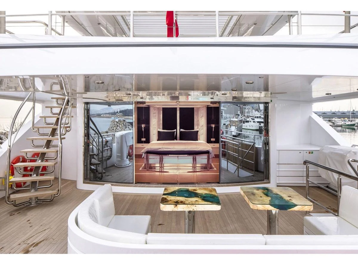 a room with a table and chairs aboard DOMENIKA Yacht for Sale