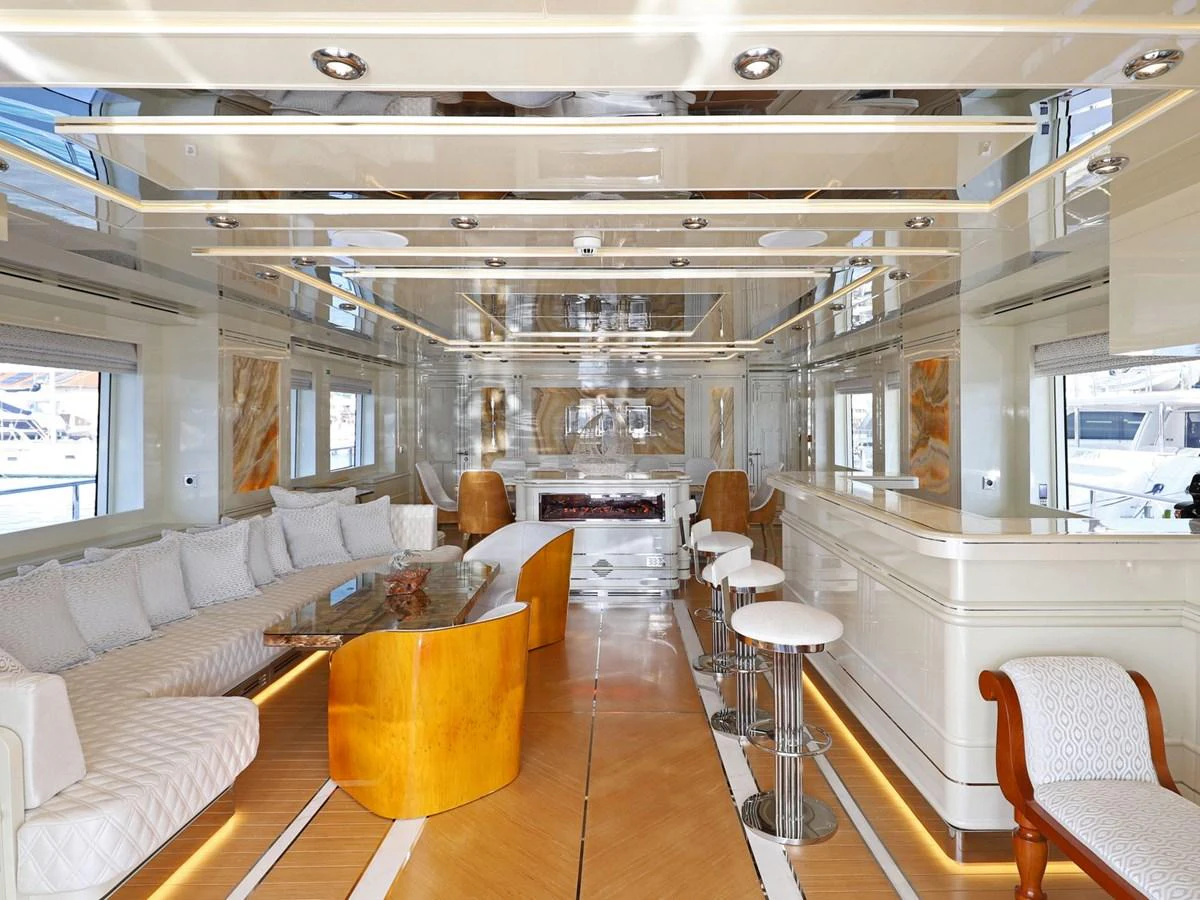 a room with a couch and a table aboard DOMENIKA Yacht for Sale
