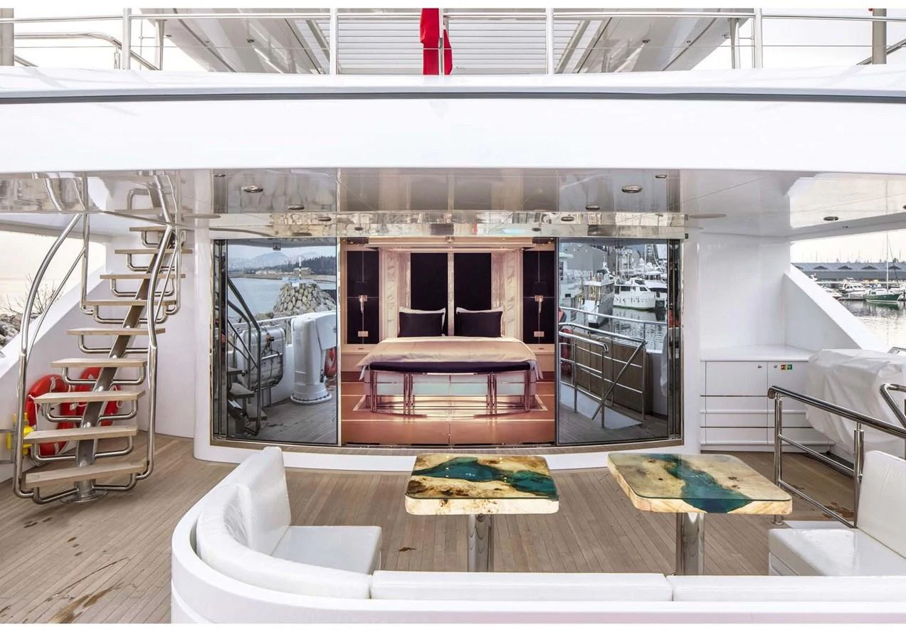 a room with a table and chairs aboard DOMENIKA Yacht for Sale