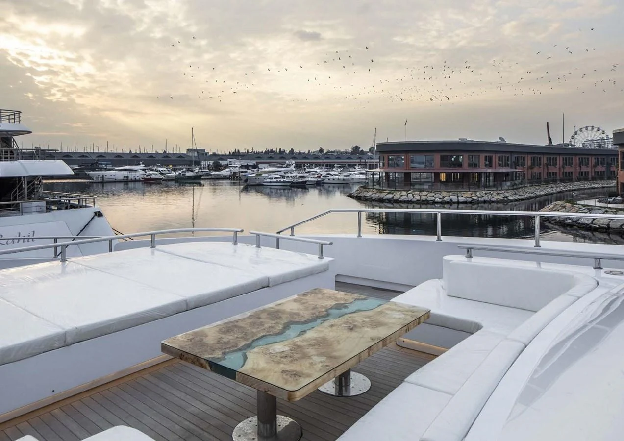 a deck with a view of a city and water aboard DOMENIKA Yacht for Sale