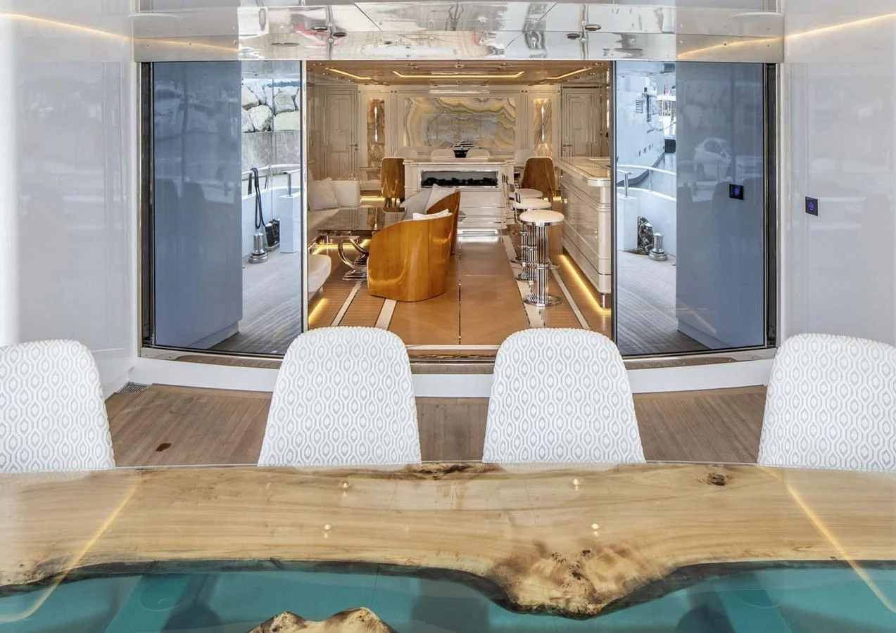 a room with a table and chairs aboard DOMENIKA Yacht for Sale