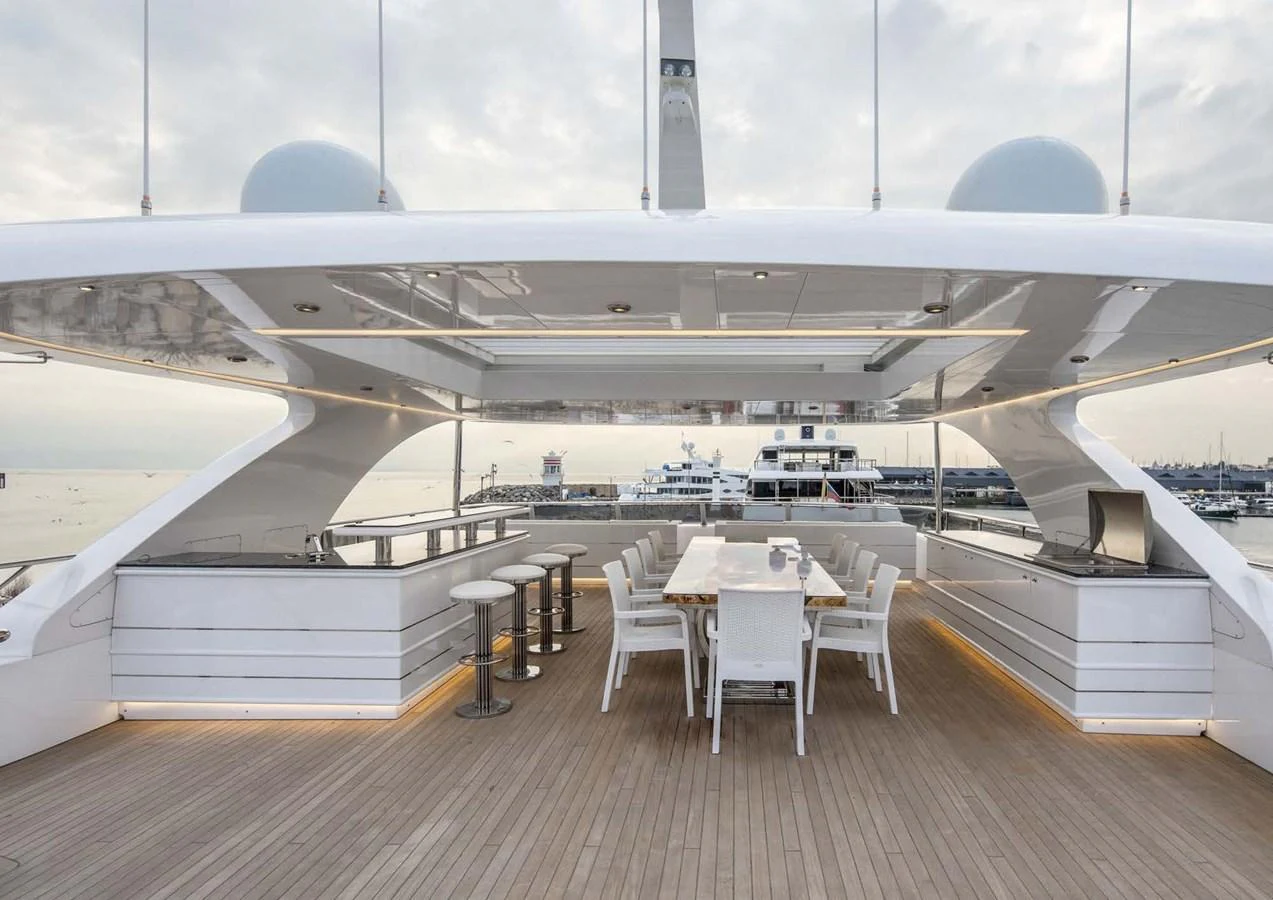 a large room with tables and chairs aboard DOMENIKA Yacht for Sale