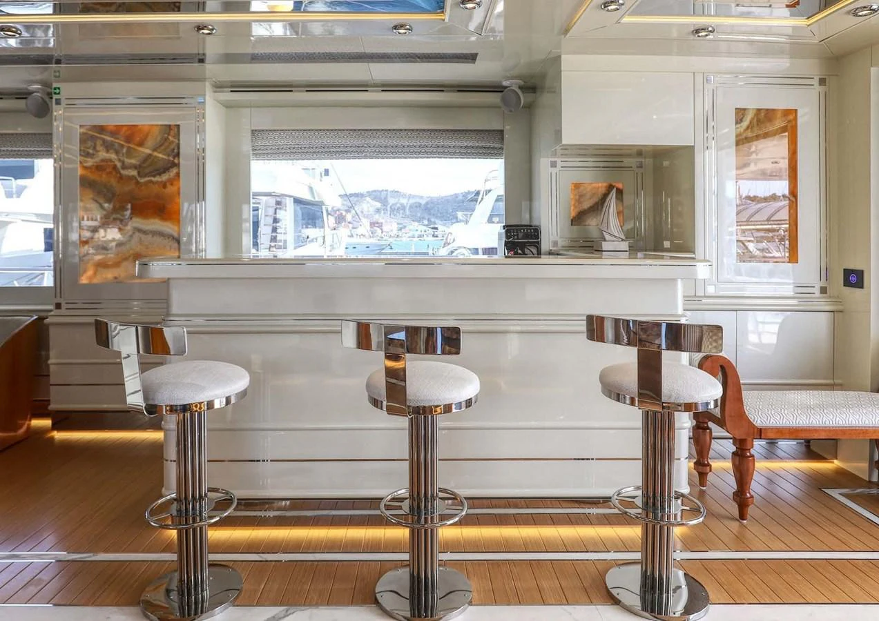 a room with stools and stools aboard DOMENIKA Yacht for Sale