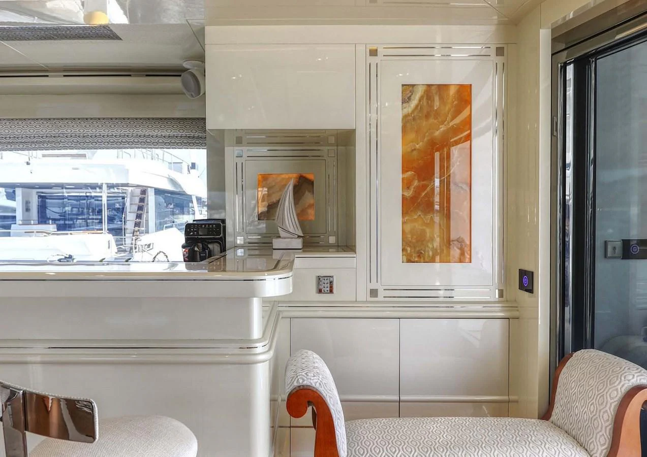 a person sitting in a chair aboard DOMENIKA Yacht for Sale