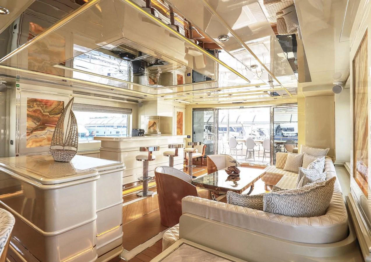 a living room with a large window aboard DOMENIKA Yacht for Sale