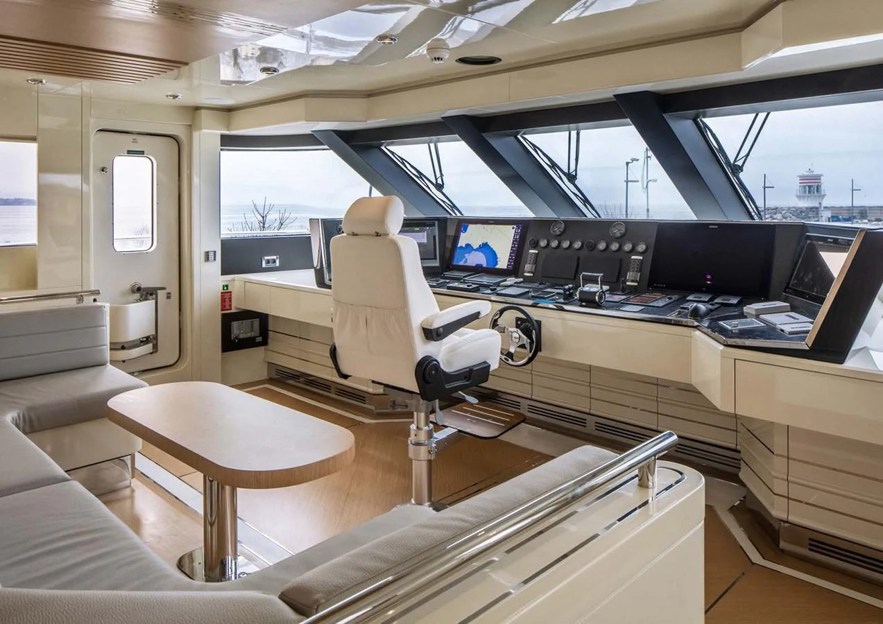 inside of a vehicle with a desk and a computer aboard DOMENIKA Yacht for Sale