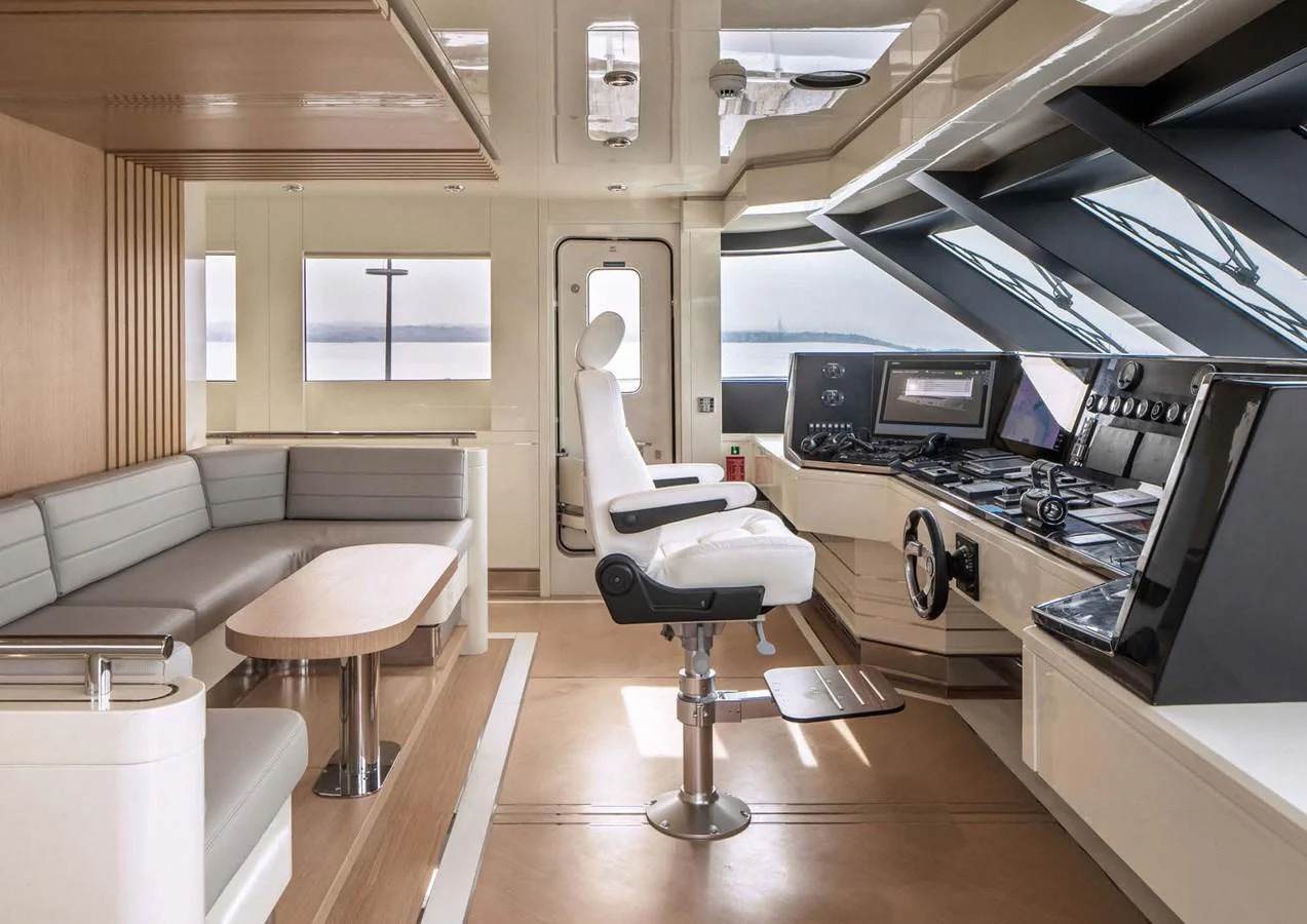 a room with a desk and chairs aboard DOMENIKA Yacht for Sale