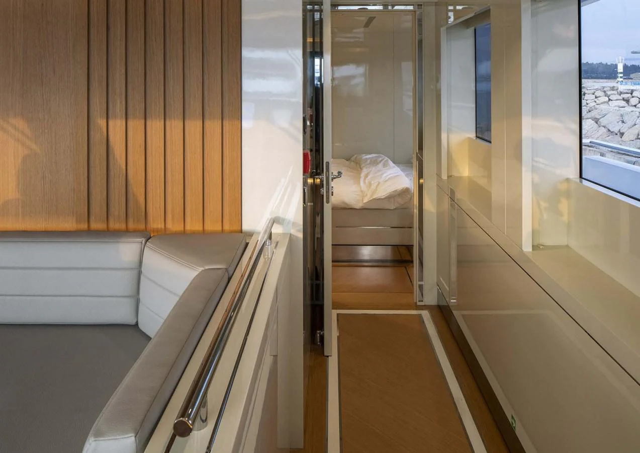 a room with a bed and a window aboard DOMENIKA Yacht for Sale