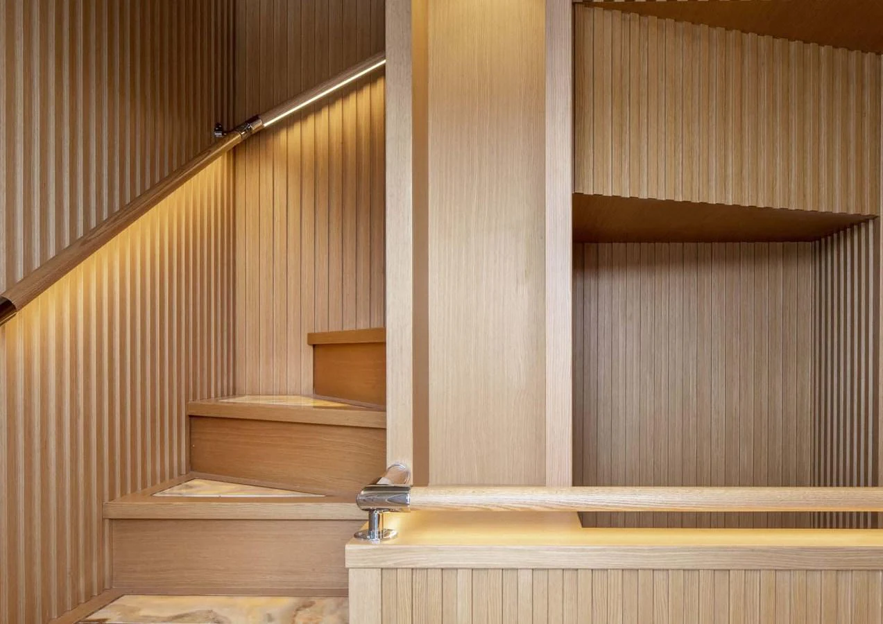 a set of wooden stairs aboard DOMENIKA Yacht for Sale