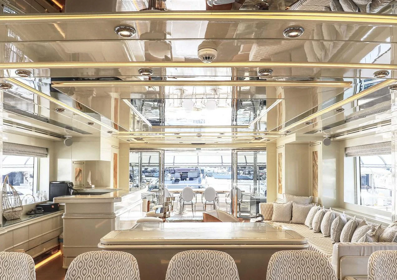 a room with a table and chairs aboard DOMENIKA Yacht for Sale