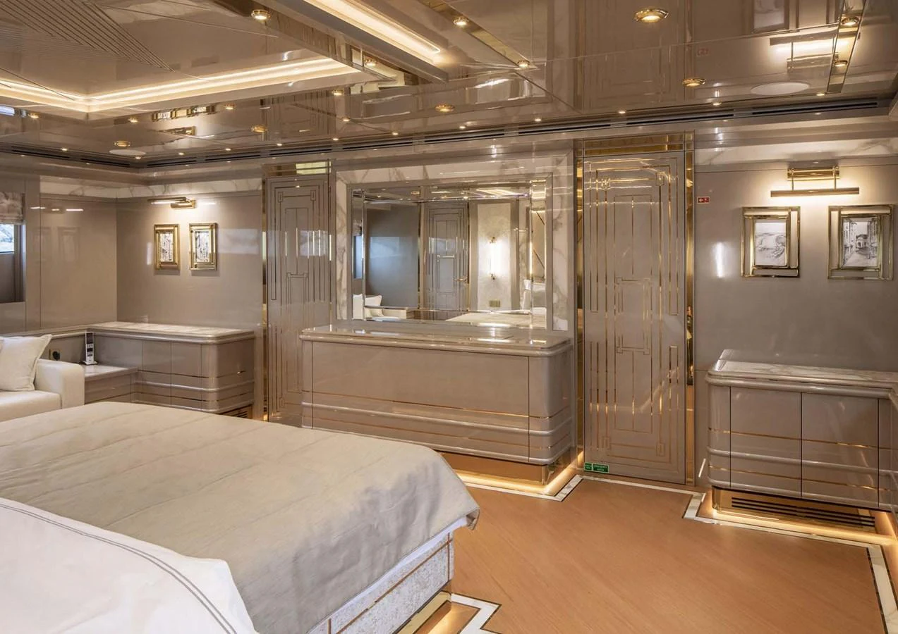 a room with a bed and a desk aboard DOMENIKA Yacht for Sale