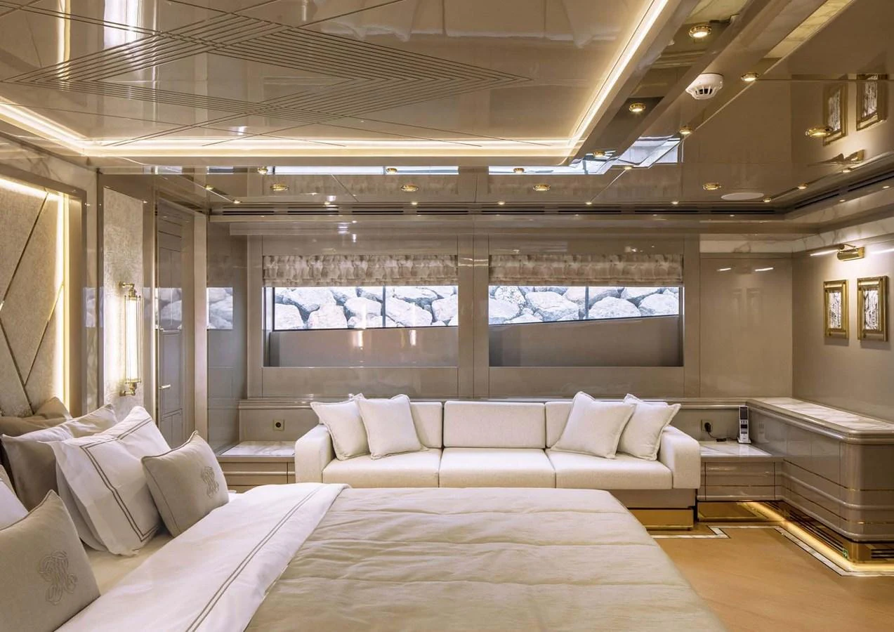 a large room with a bed and a large window aboard DOMENIKA Yacht for Sale