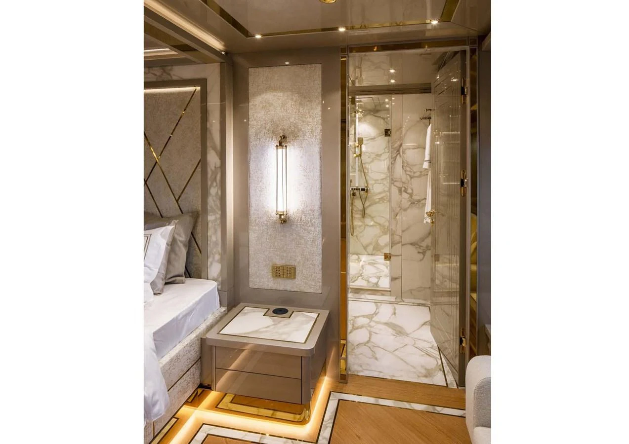 a room with a bed and a mirror aboard DOMENIKA Yacht for Sale