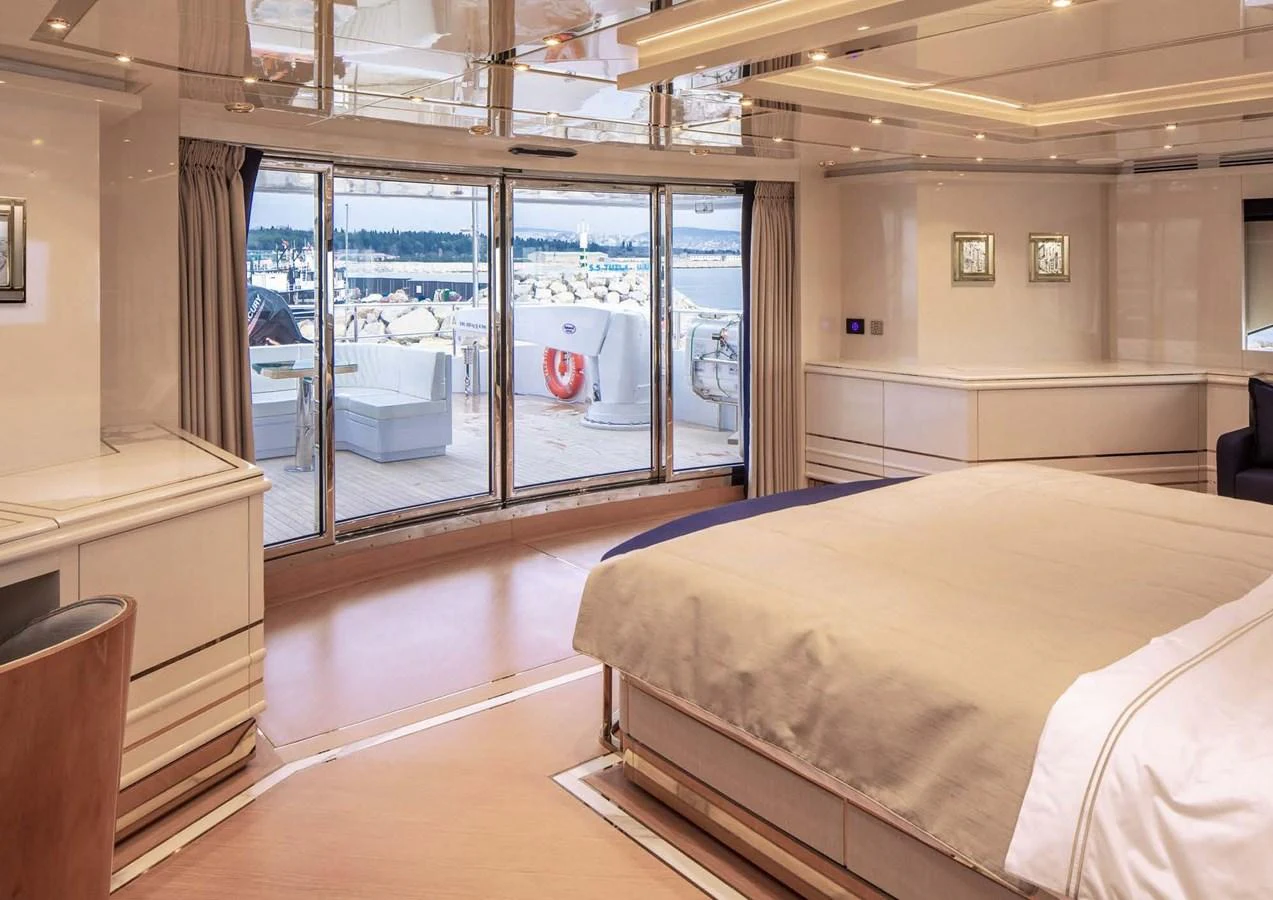a room with a bed and a window aboard DOMENIKA Yacht for Sale