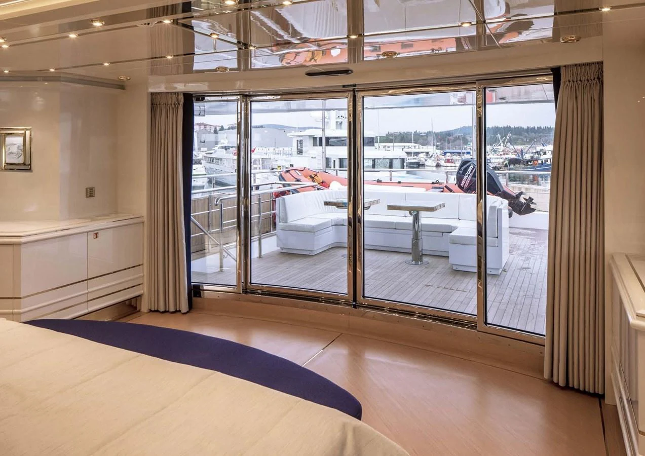 a room with a large glass door aboard DOMENIKA Yacht for Sale