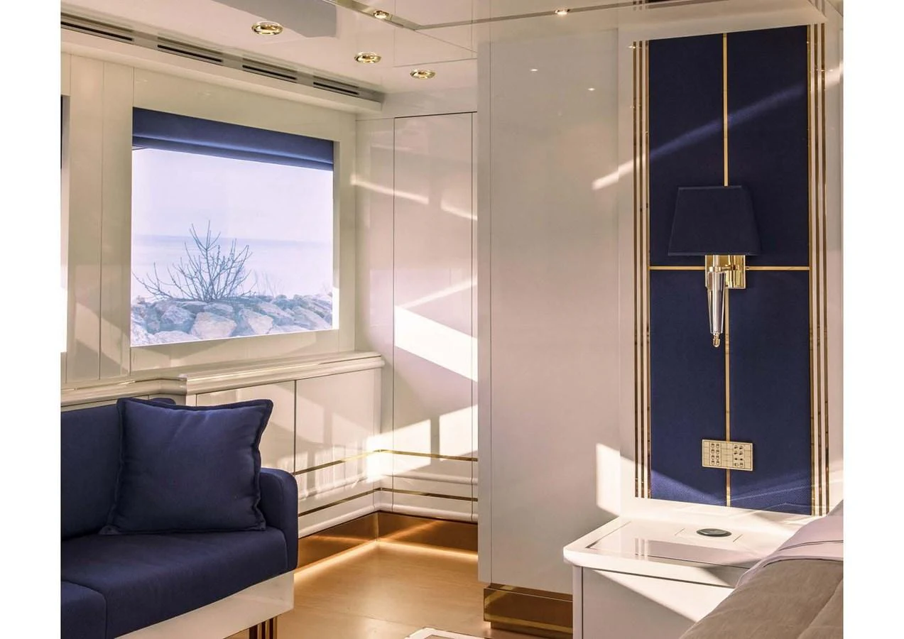 a room with a lamp and a couch aboard DOMENIKA Yacht for Sale